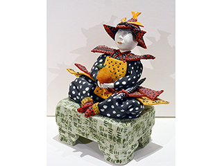 Man w/ squash on stool by Vicky Chock (View 2)